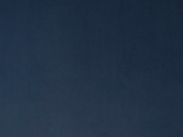 Deep navy-blue velvet with a soft, subtly shifting pile and plain surface