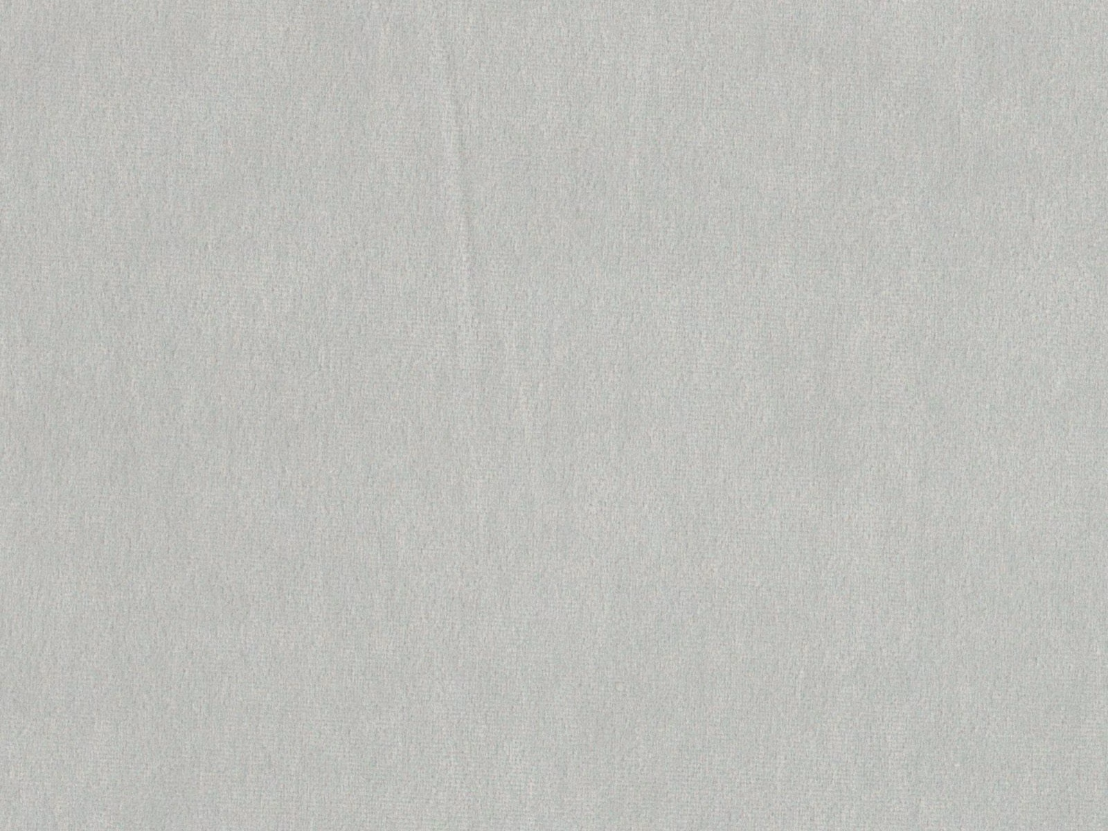 Pale cool-grey velvet swatch showing a smooth brushed nap and subtle tonal shading