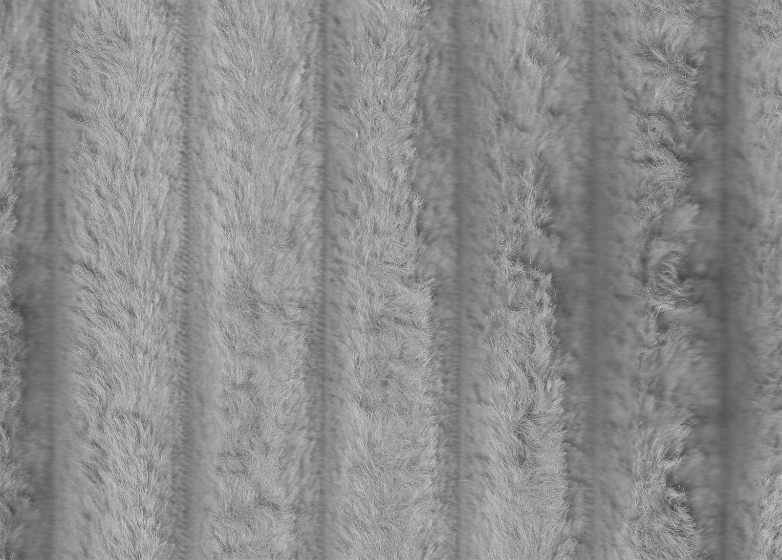 Cool silver-grey faux fur with shaggy vertical channels and softly varied pile texture