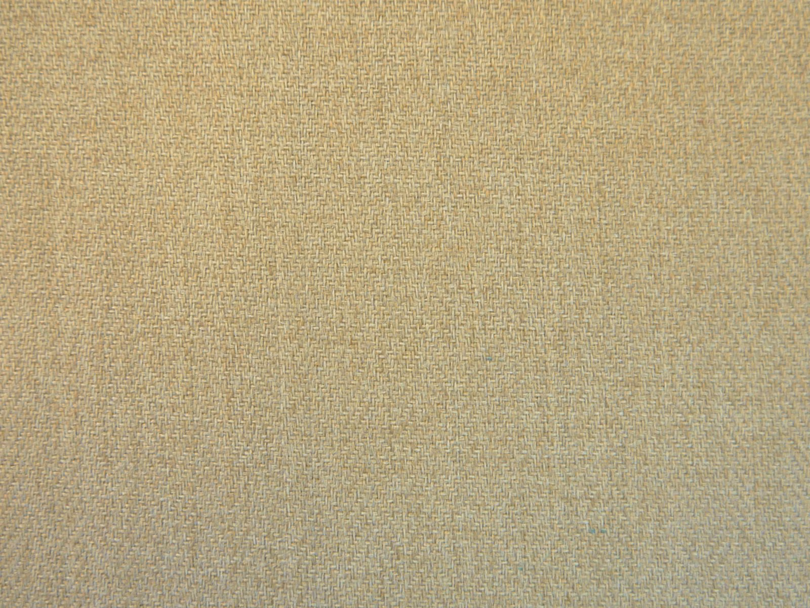 Close-up of muted oatmeal-beige chenille with a fine, softly mottled woven texture