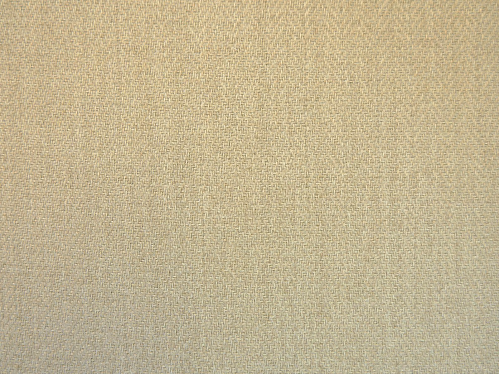 Close-up of warm oat-beige chenille with fine crosshatched woven texture