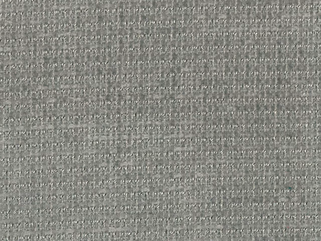 Close-up of cool grey chenille with fine horizontal texture and pale flecks