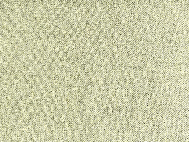 Pale sage flat weave with fine diagonal texture and scattered darker flecks