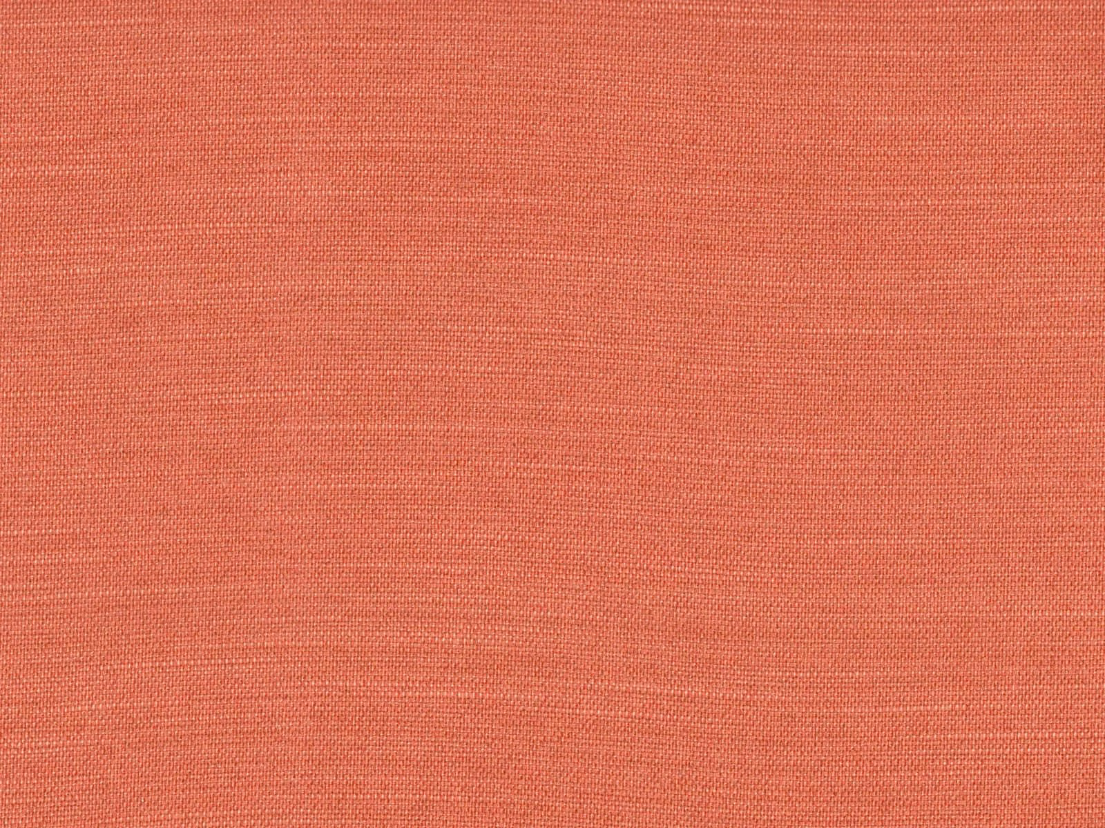 Close-up of warm coral terracotta flat weave with fine horizontal texture