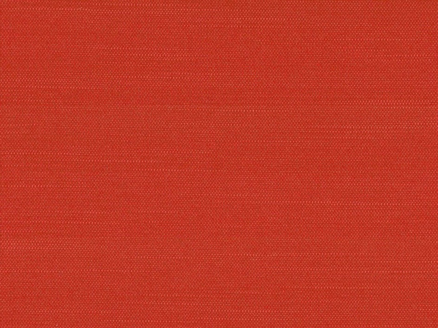 Close-up of warm brick-red flat weave with fine crosshatched polyester texture