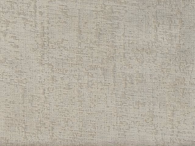 Pale greige chenille with softly mottled horizontal texture and subtle woven variation