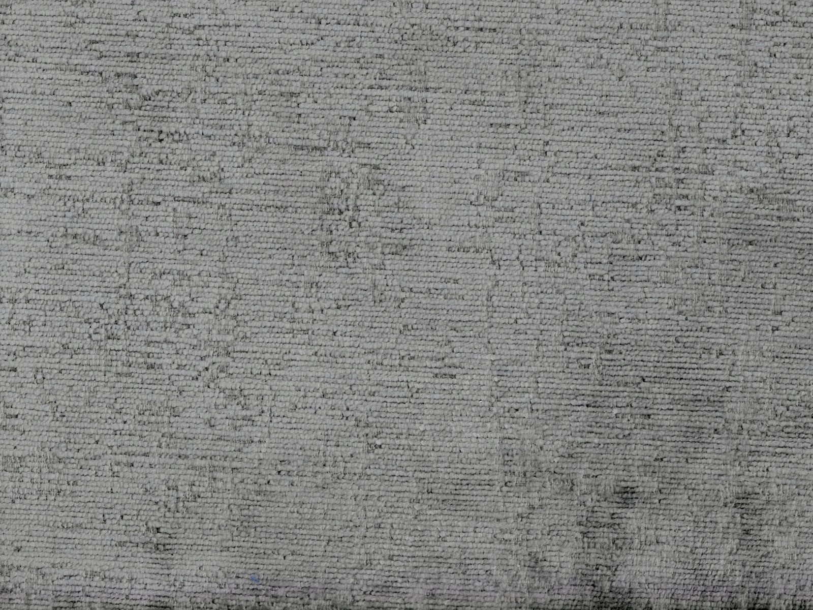 Mottled mid-grey chenille with fine horizontal ribbing and darker flecked texture