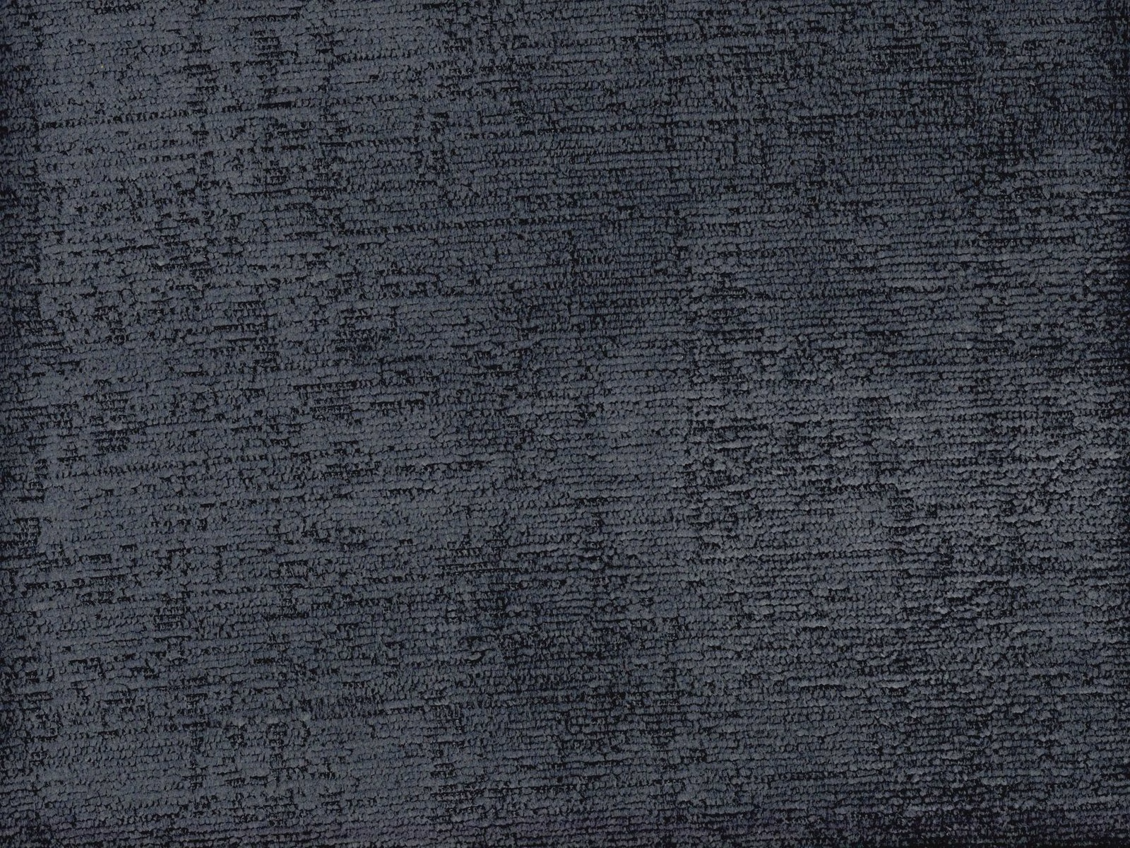 Charcoal-grey chenille with dense, irregular horizontal texture and softly shifting highlights