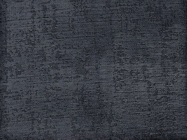 Charcoal-grey chenille with dense, irregular horizontal texture and softly shifting highlights