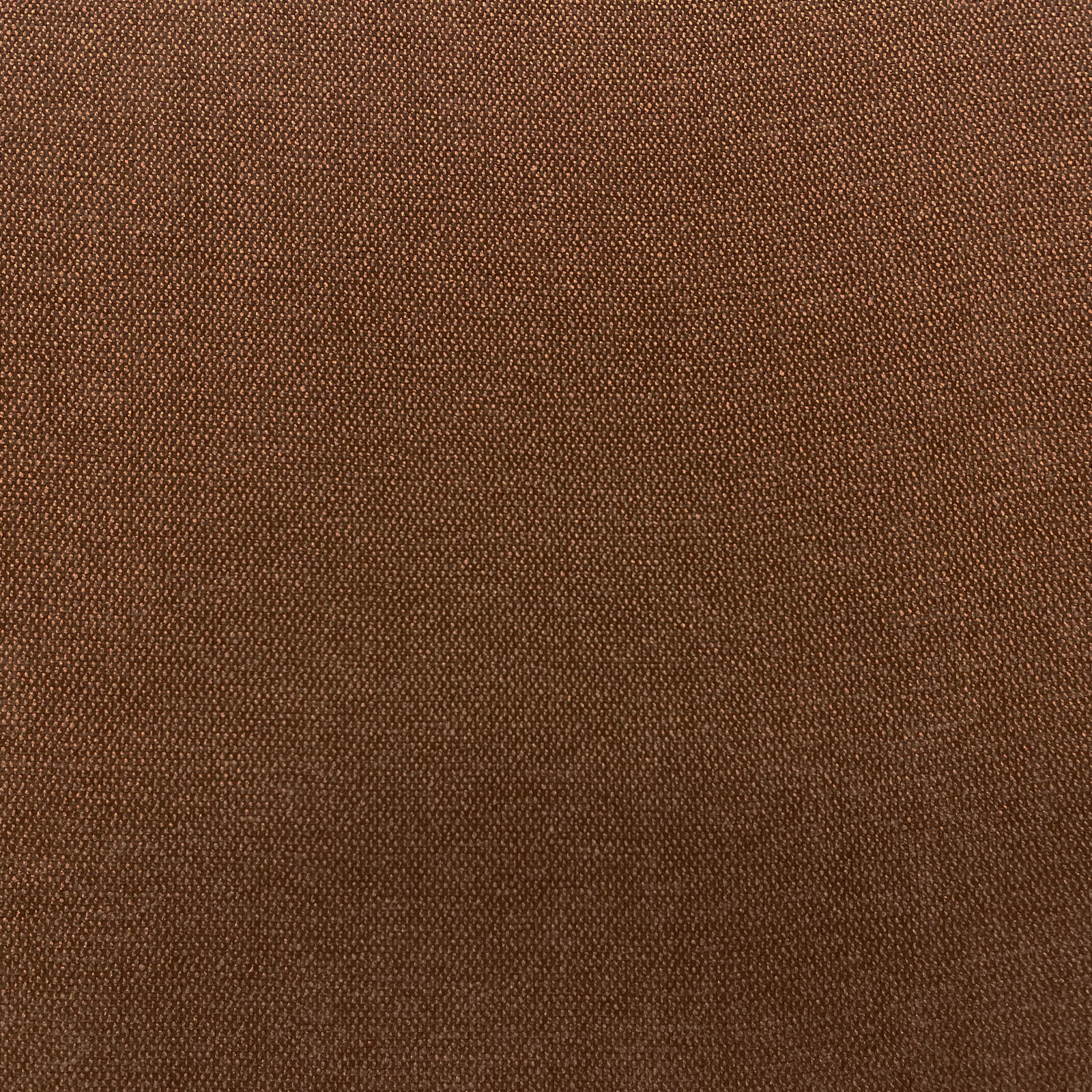 Close-up of warm chestnut-brown chenille with a fine pebbled woven texture
