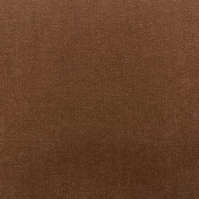 Close-up of warm chestnut-brown chenille with a fine pebbled woven texture