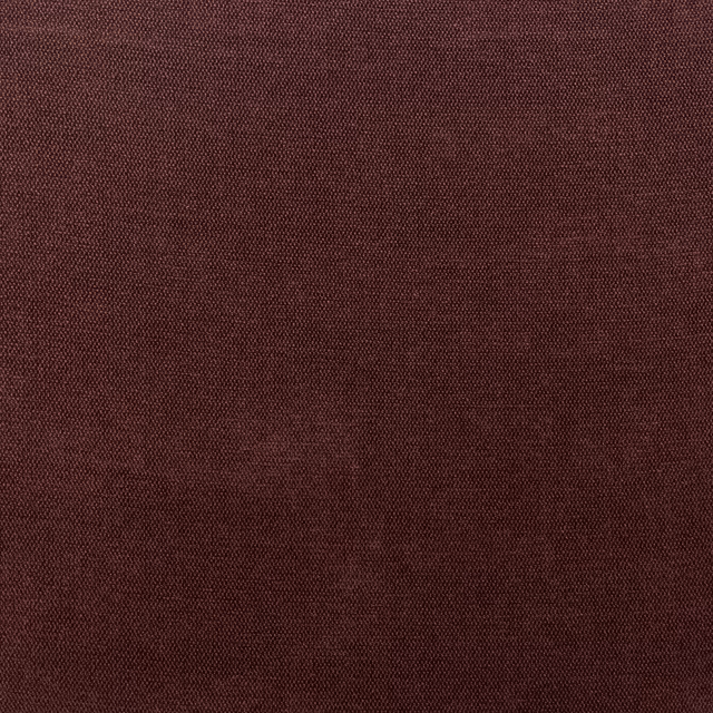 Close-up of deep burgundy chenille with a fine, subtly mottled woven texture