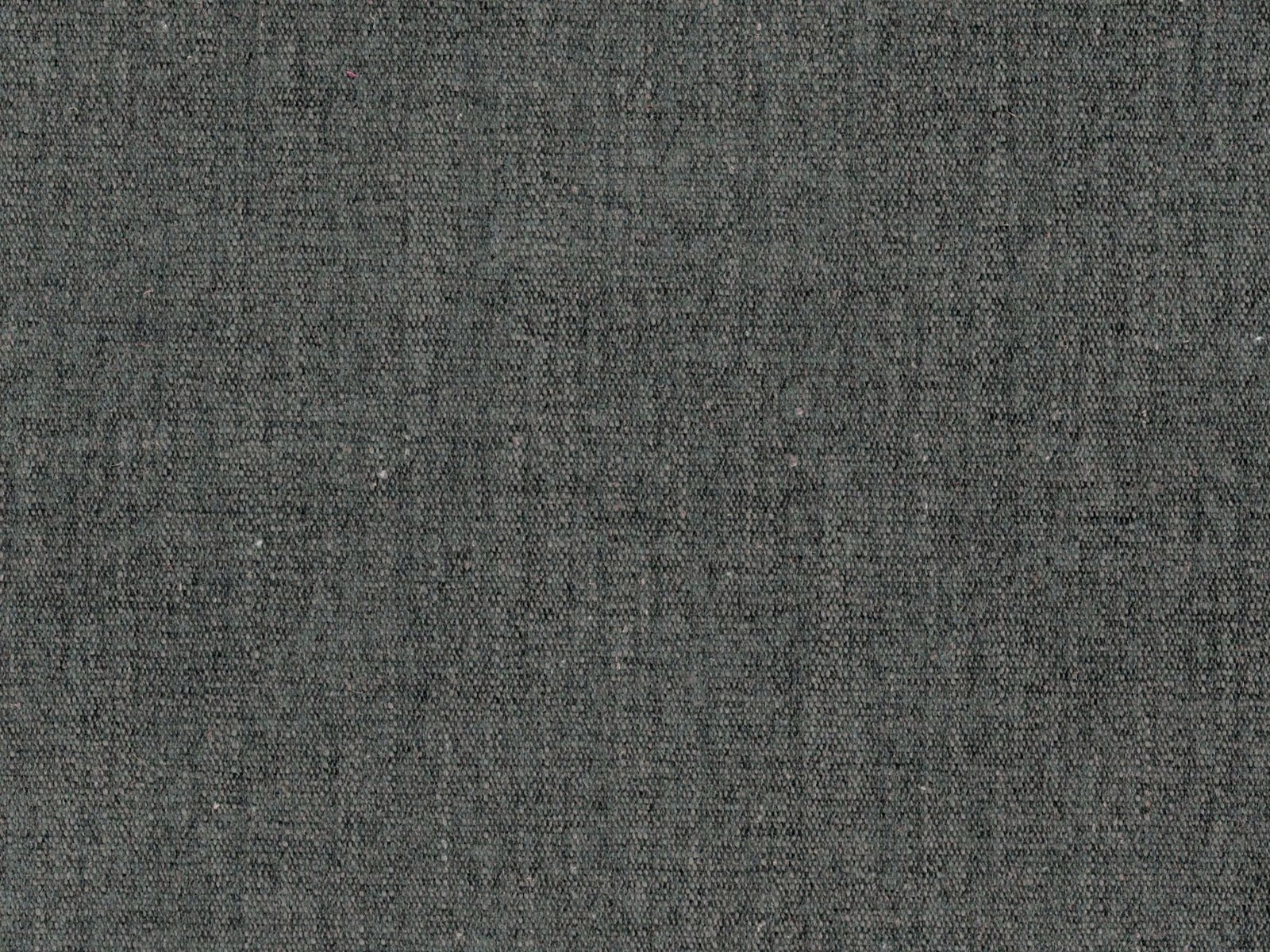 Mottled charcoal-grey flat weave with fine irregular grain and subtle tonal texture