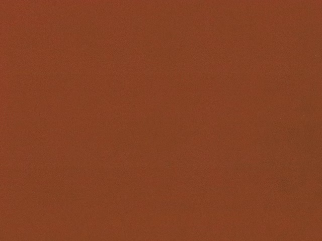 Burnt terracotta red plain velvet with subtle directional pile shading