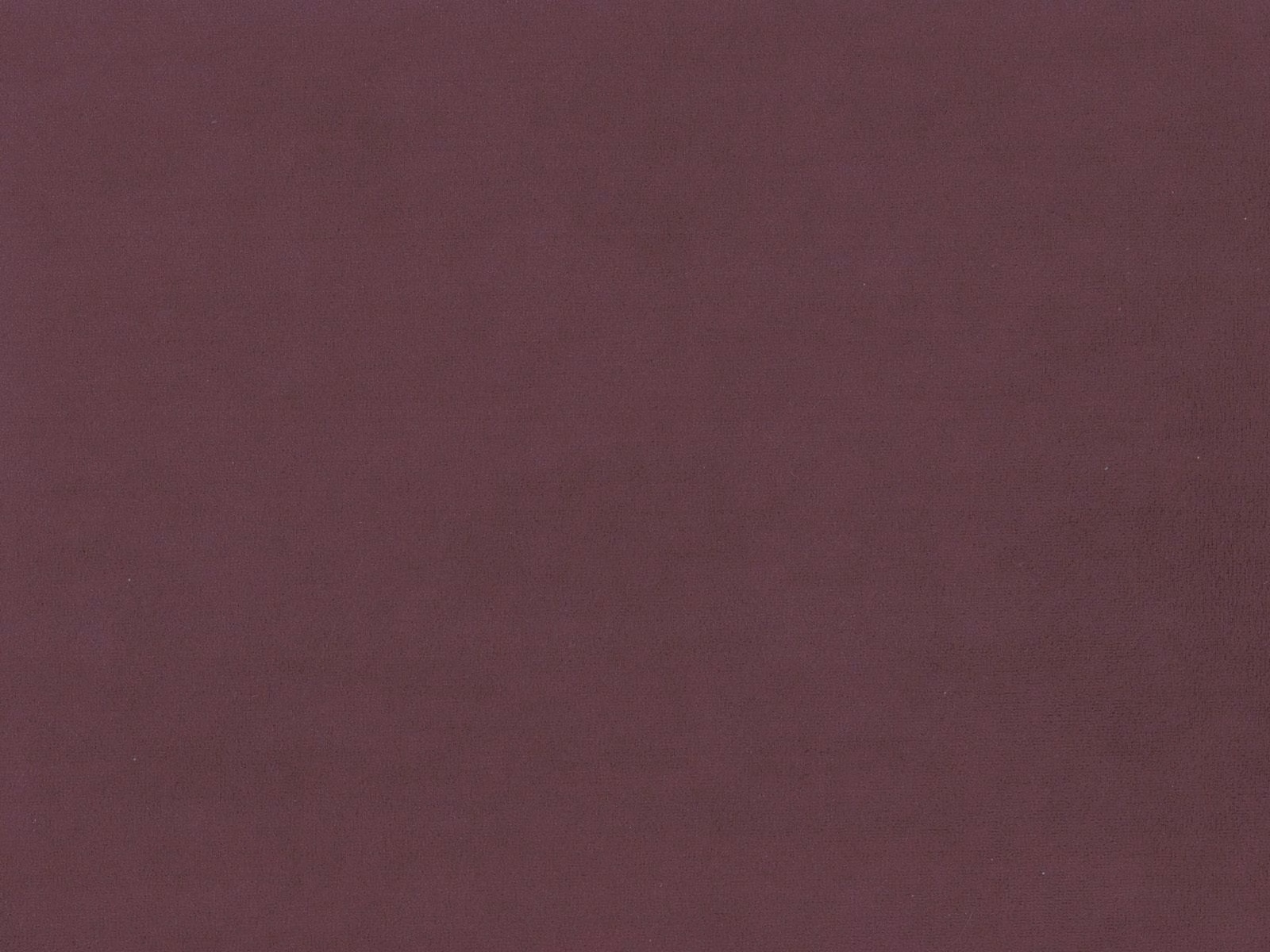 Deep plum burgundy velvet swatch with a smooth, subtly shaded surface