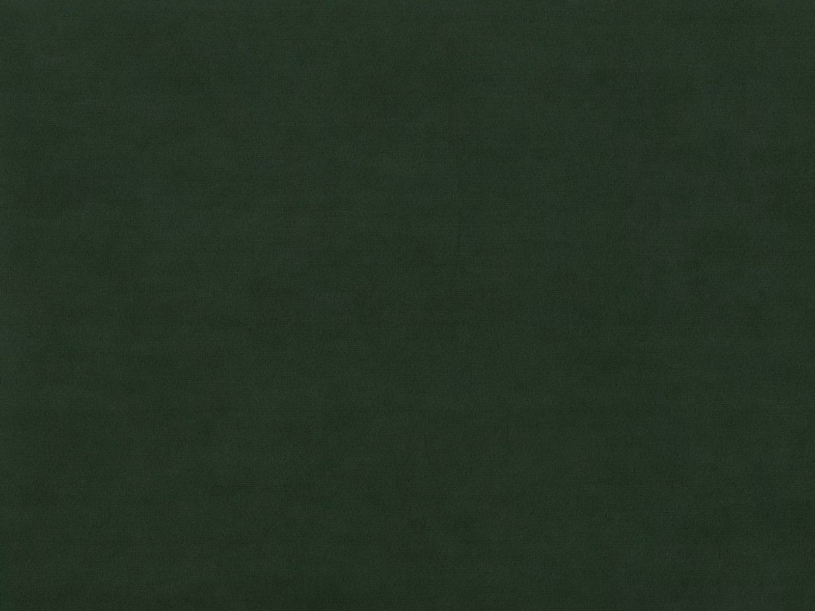 Deep forest-green velvet with subtle nap shading across a plain surface