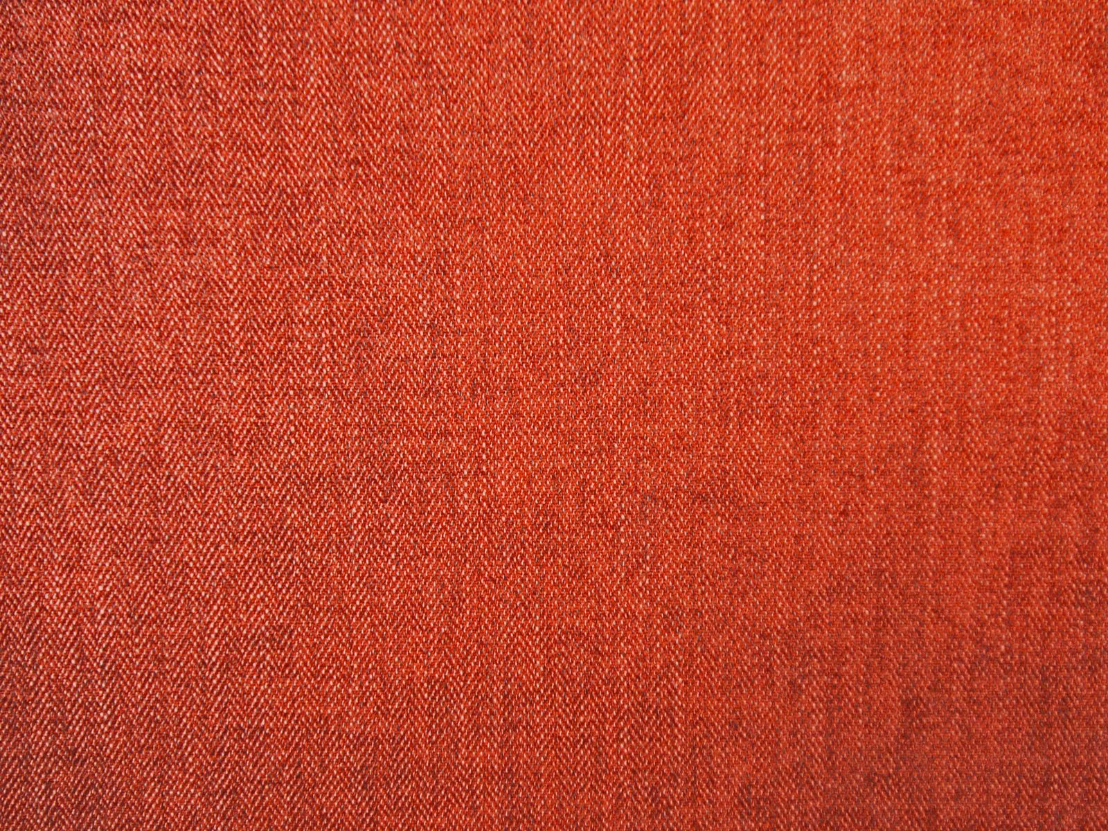 Warm terracotta red chenille with fine chevron weave and subtly varied texture