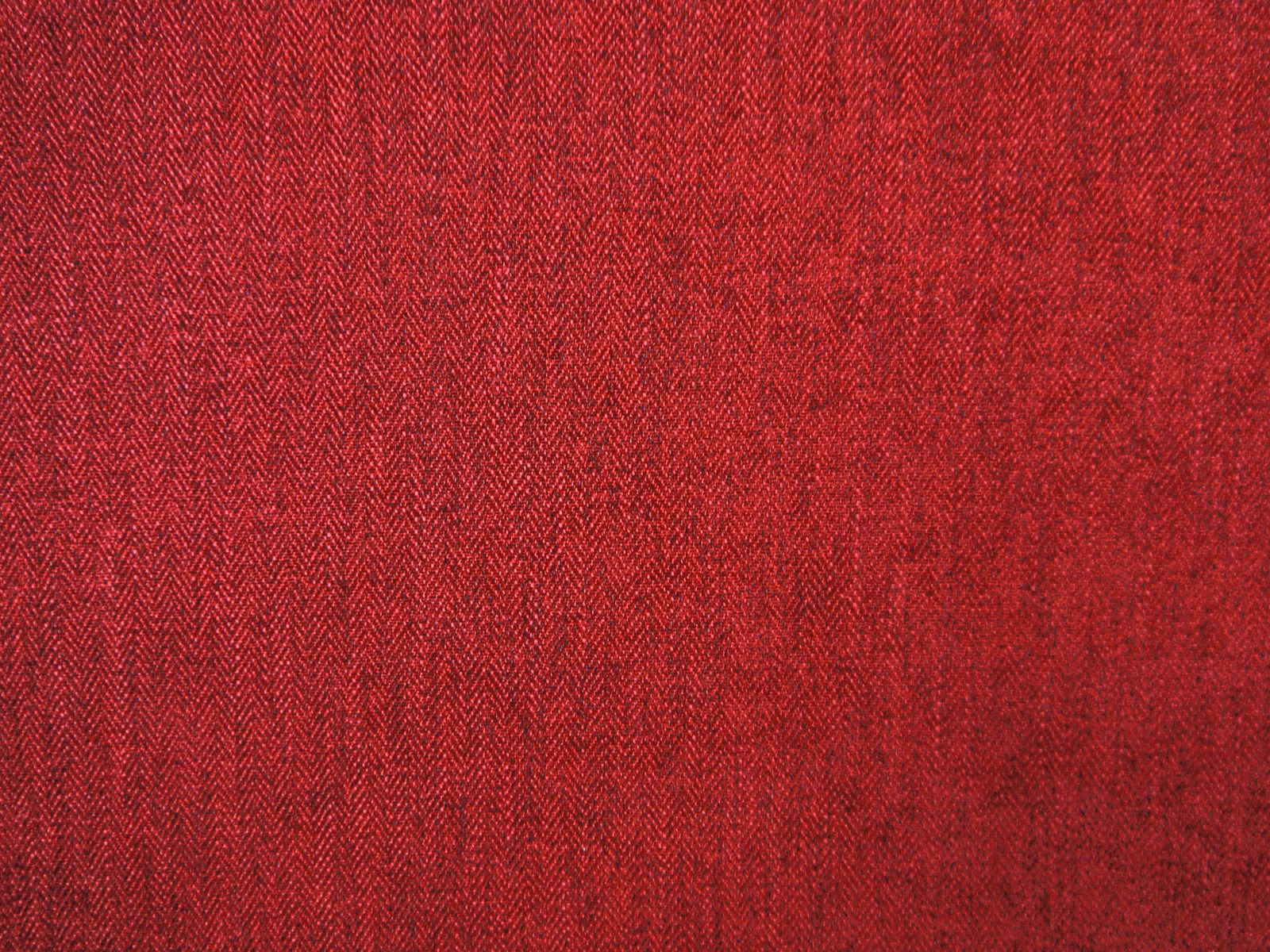 Deep crimson chenille with fine tonal herringbone texture and darker red flecks