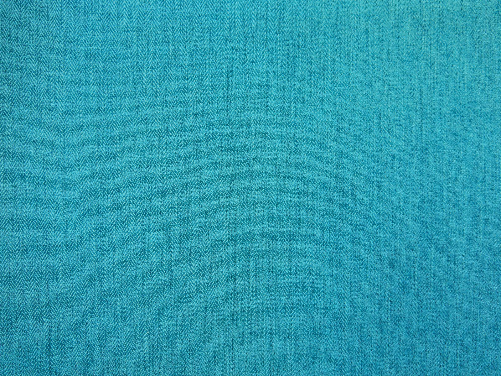 Turquoise teal chenille with fine vertical chevron weave and softly varied texture