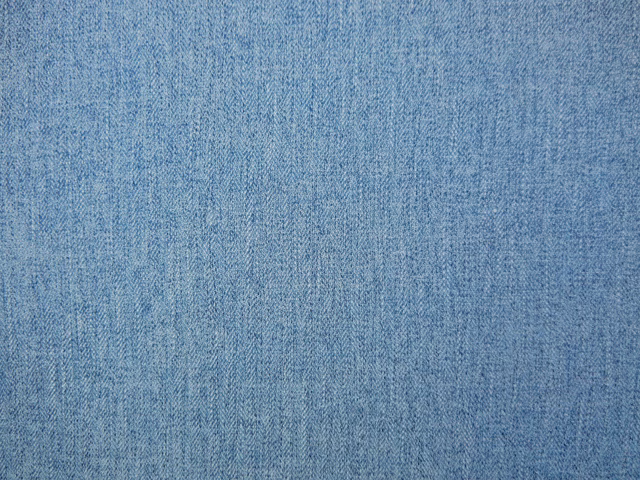 Muted denim-blue chenille with fine vertical slub texture and softly mottled shading