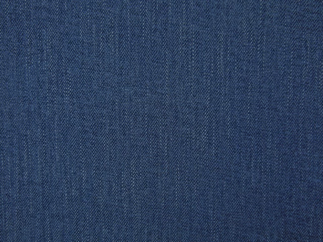 Deep denim-blue chenille with a fine vertical herringbone texture