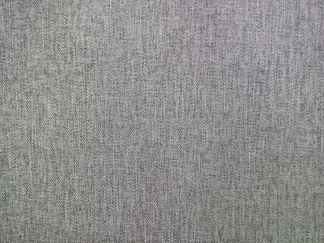 Misty grey-green chenille with a fine tonal herringbone weave and softly mottled texture