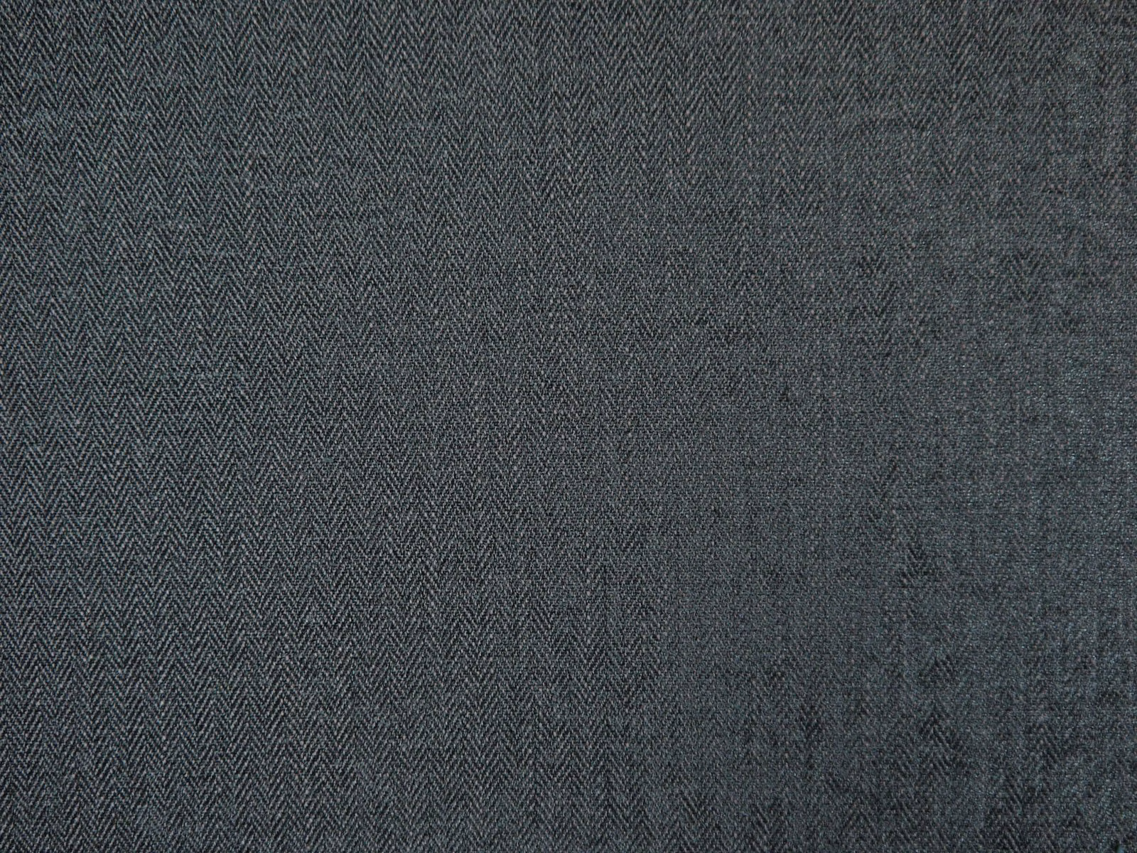 Close view of charcoal chenille with fine herringbone weave and subtle tonal texture