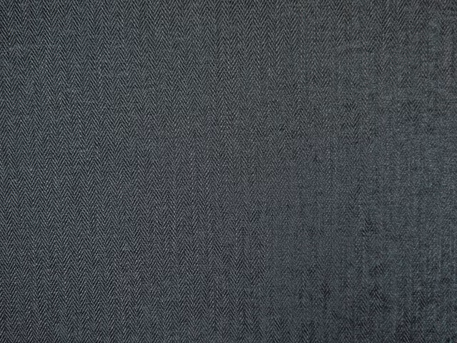 Close view of charcoal chenille with fine herringbone weave and subtle tonal texture