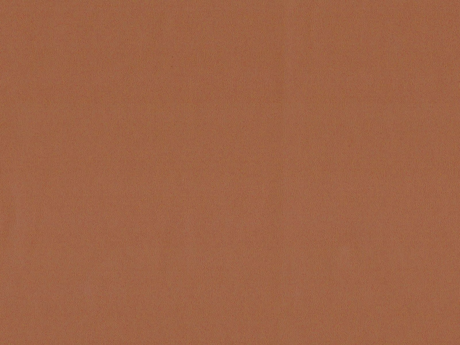 Muted terracotta faux leather showing a smooth, fine-grained surface