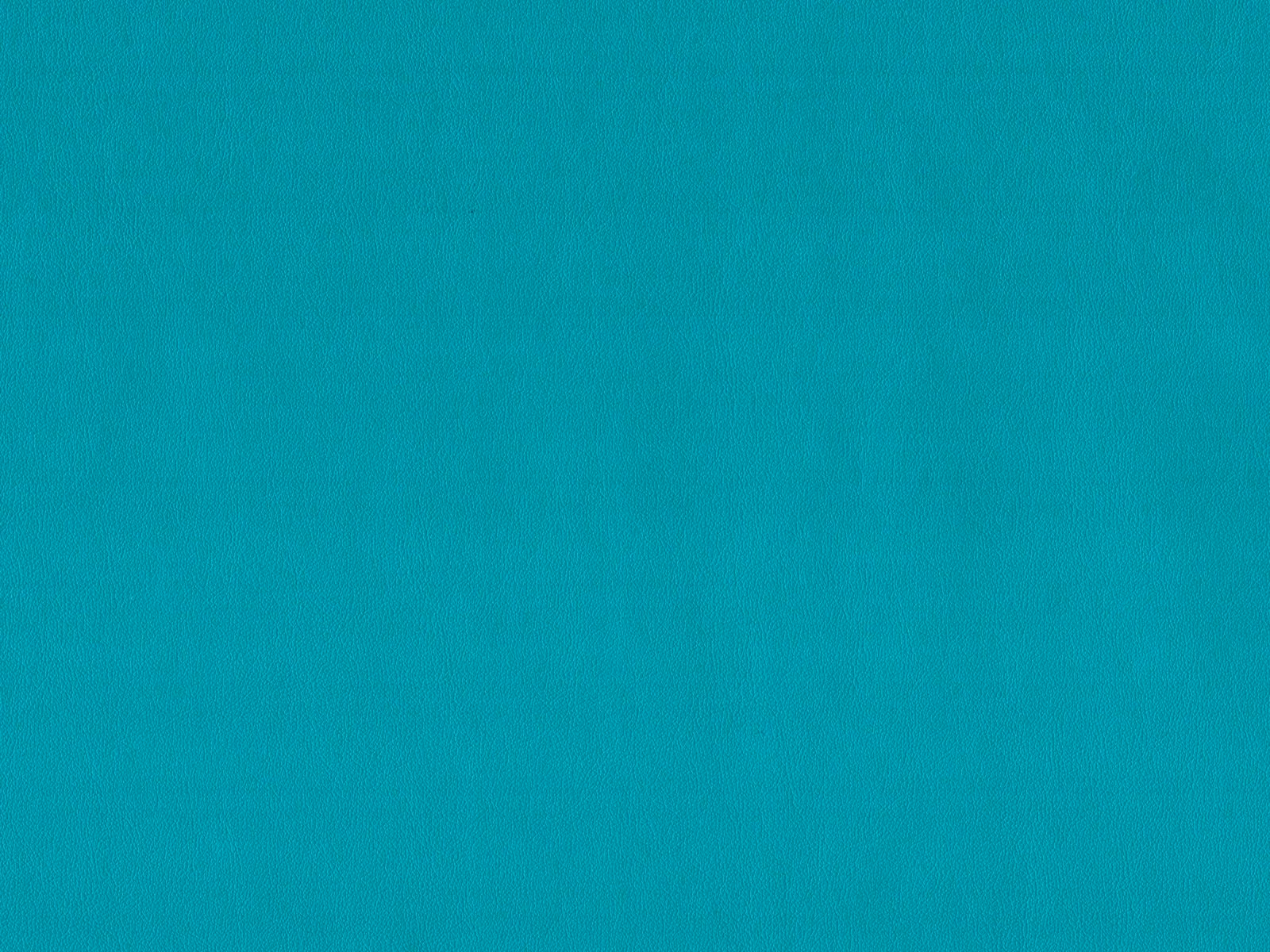 Close-up of vivid turquoise teal faux leather with a subtle fine grain