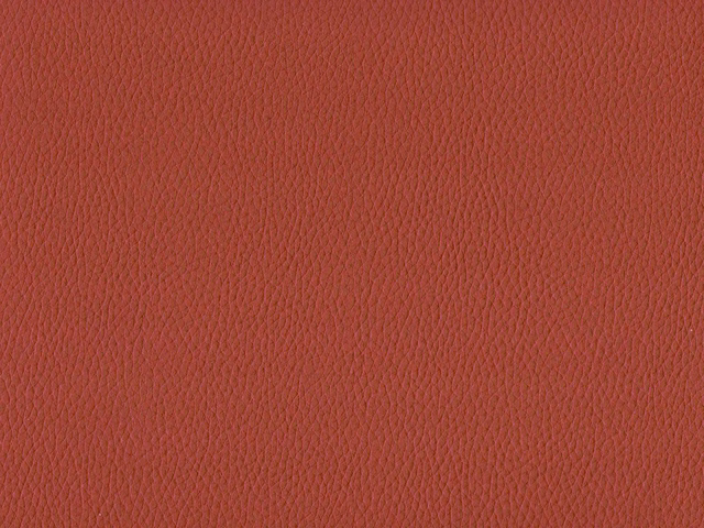 Muted terracotta-red faux leather with fine pebbled grain and subtle surface sheen
