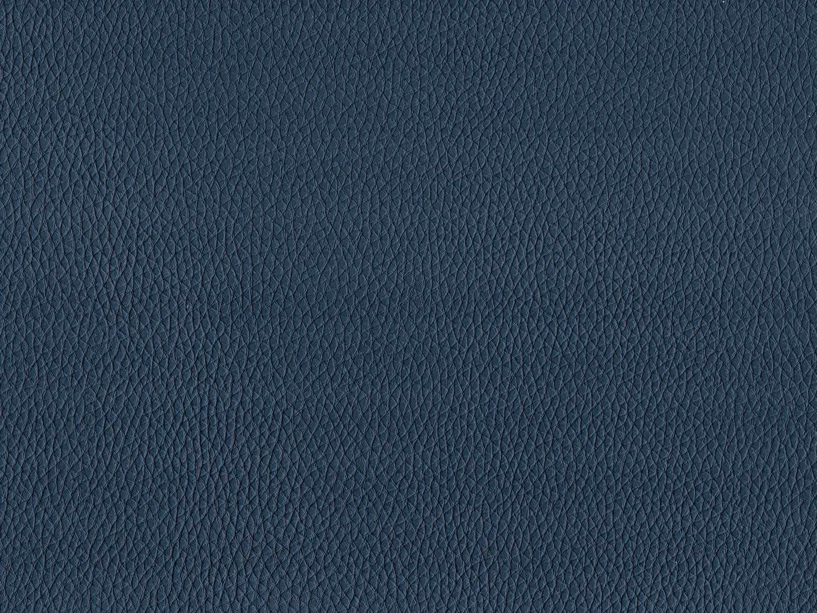 Deep slate-blue faux leather with a finely pebbled grain and even surface
