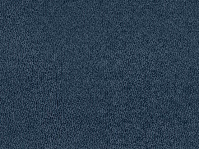Deep slate-blue faux leather with a finely pebbled grain and even surface