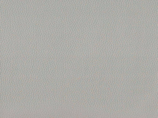 Pale blue-grey faux leather with a fine irregular pebbled grain