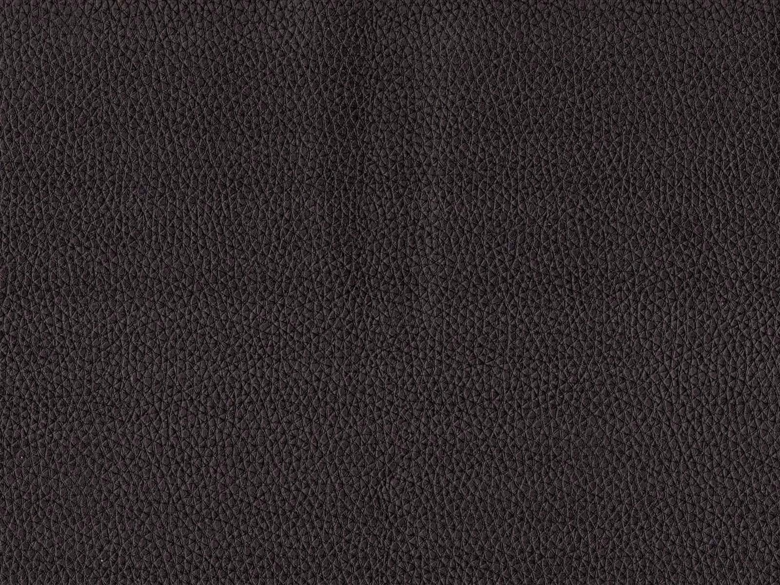 Close-up of charcoal-black pebbled faux leather with a fine low-sheen grain