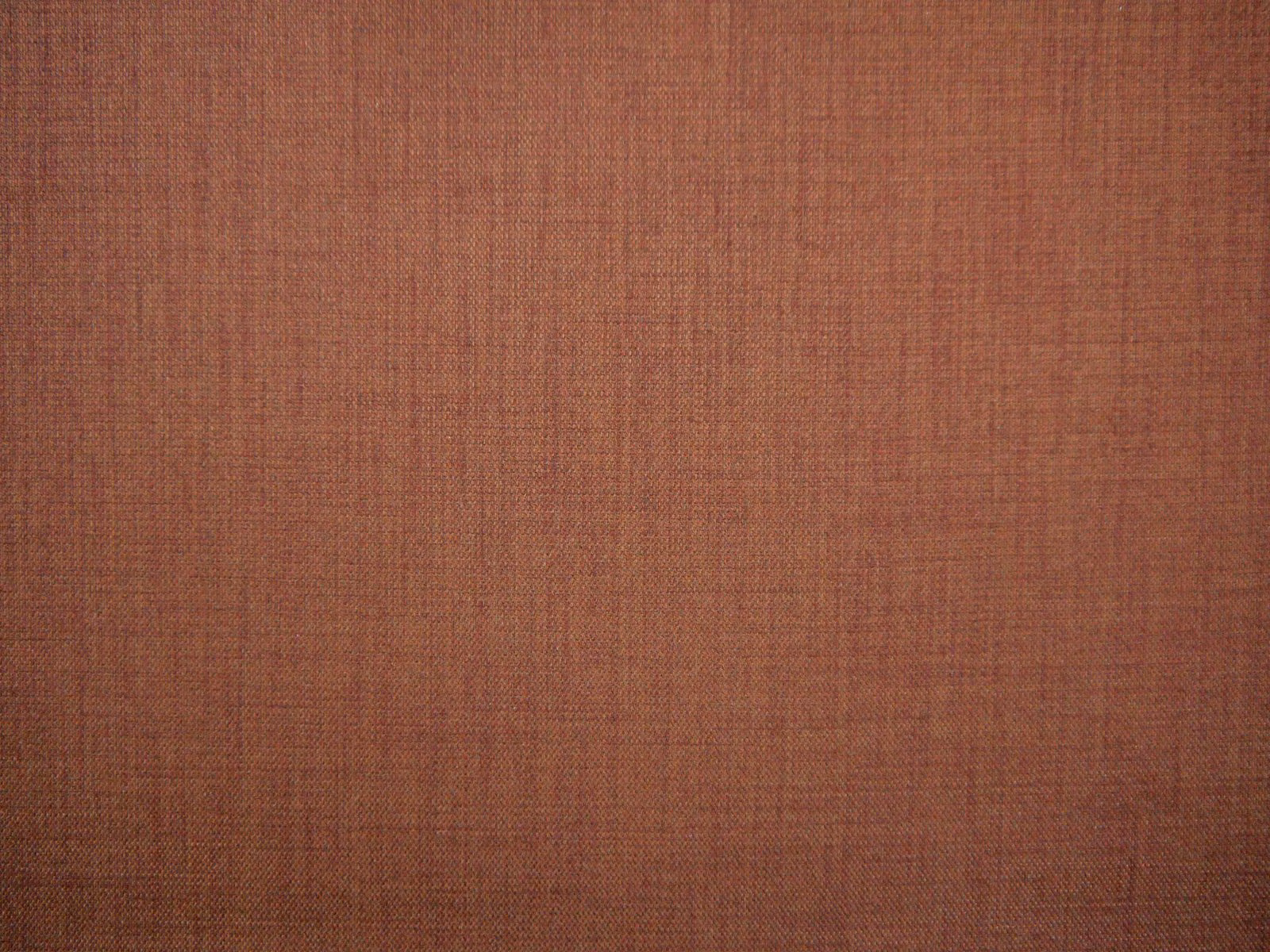 Muted terracotta TUR203 flat weave showing fine crosshatched thread texture
