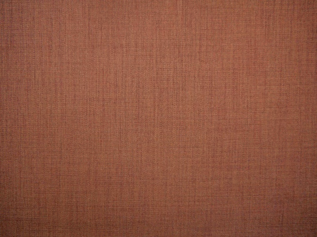 Muted terracotta TUR203 flat weave showing fine crosshatched thread texture