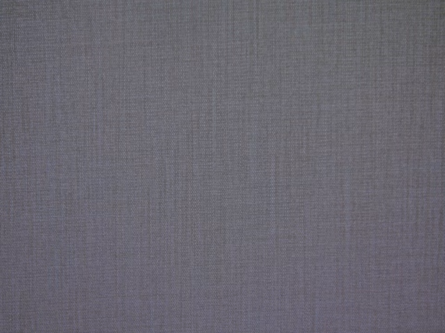 Muted mushroom taupe flat weave with subtle crosshatch texture in close-up