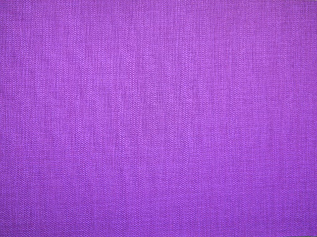 Close-up of vivid violet-purple flat weave with fine magenta crosshatch texture