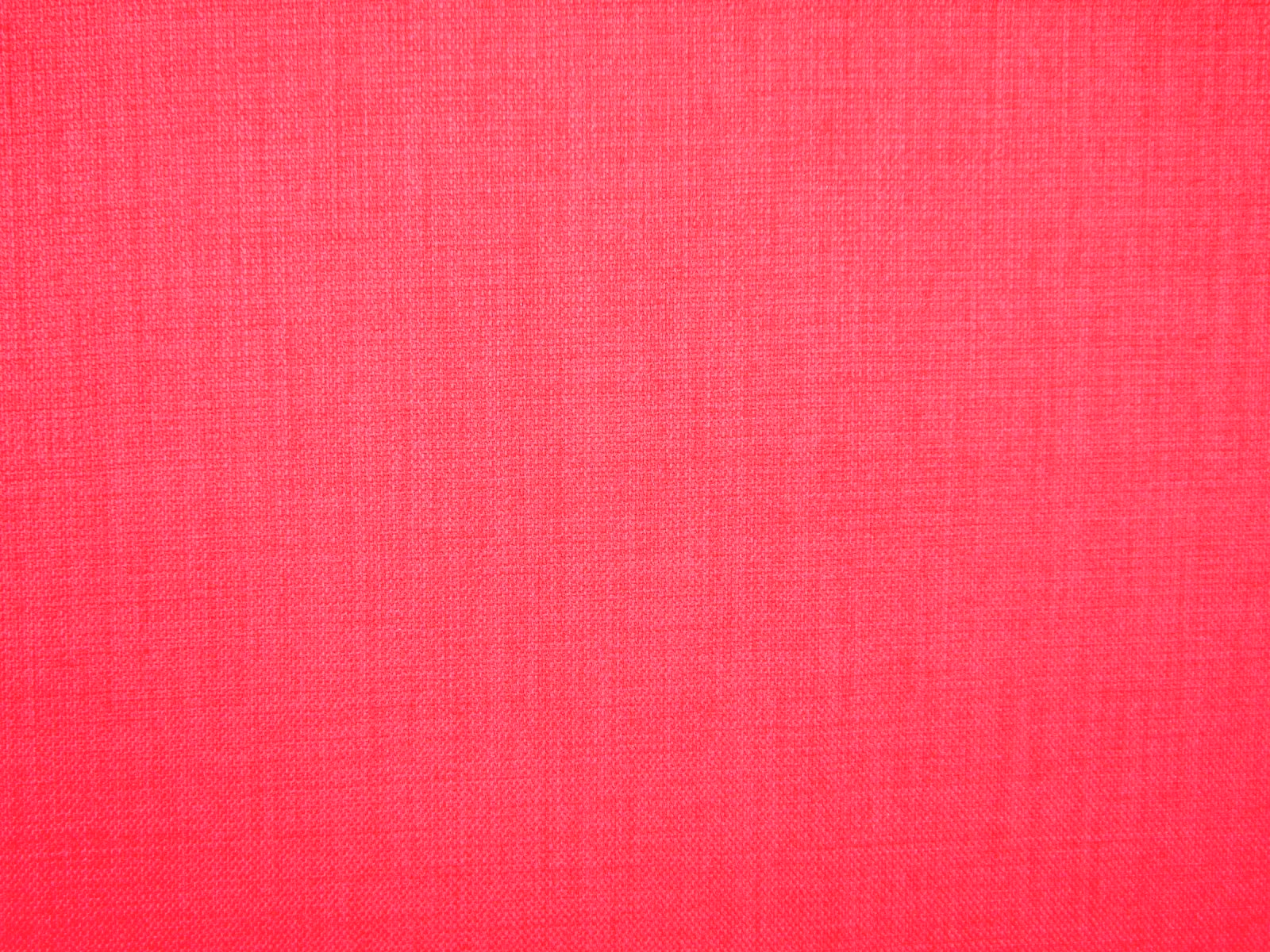 Close-up of vivid hot-pink flat weave with fine tonal crosswoven texture