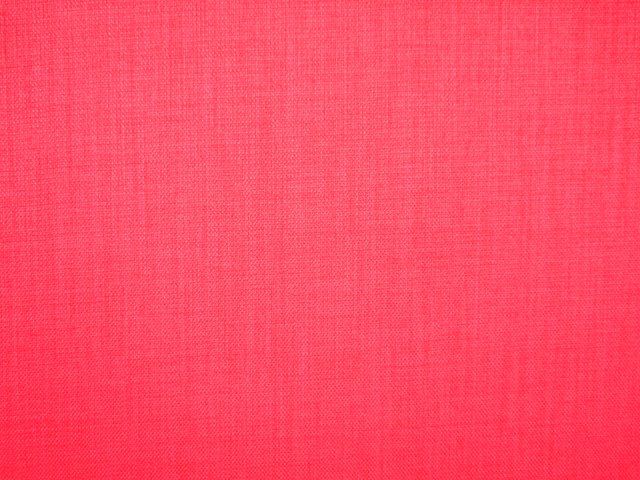 Close-up of vivid hot-pink flat weave with fine tonal crosswoven texture