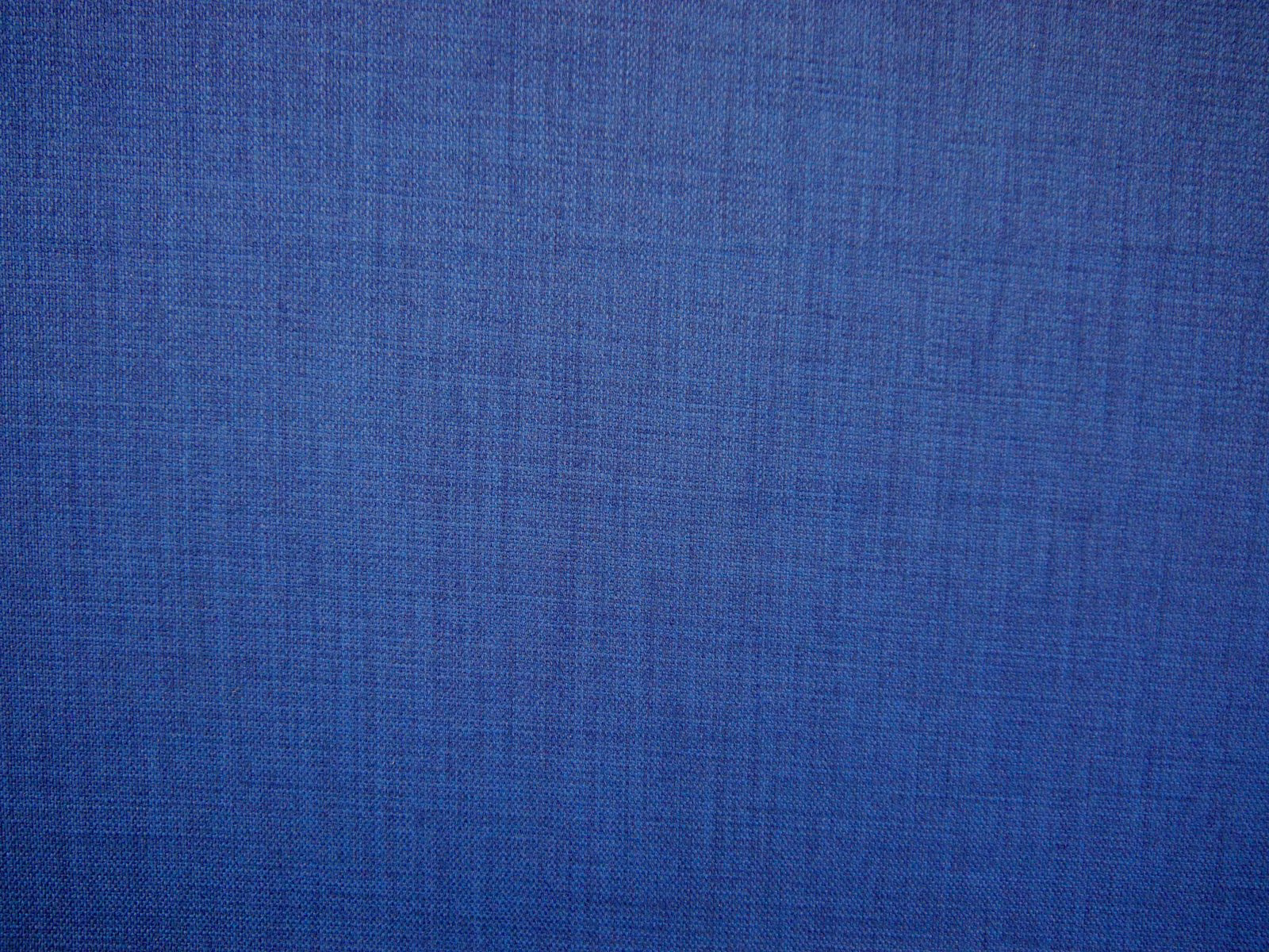 Deep cobalt-blue flat weave with subtle crosshatched texture