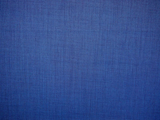 Deep cobalt-blue flat weave with subtle crosshatched texture