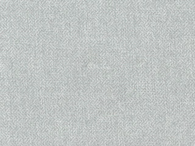 Close-up of pale grey-green chenille with a softly flecked woven surface