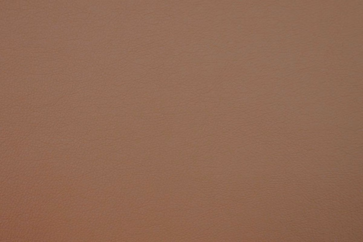 Warm mushroom-taupe faux leather with a fine pebbled grain and soft matte surface