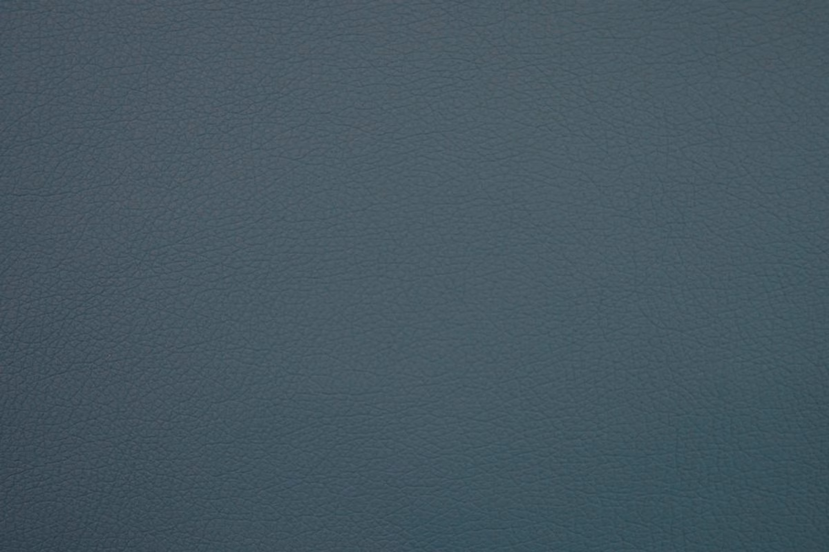 Deep blue-teal faux leather with a subtle fine pebbled grain