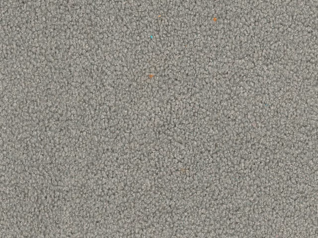 Mottled cool stone-grey fleece weave with tiny rust and teal flecks