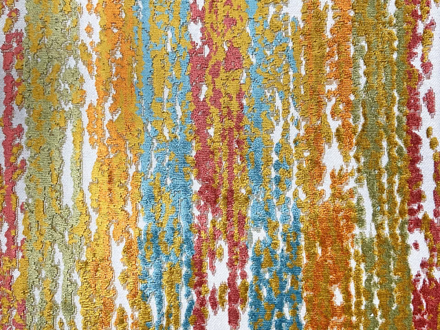 Close-up of multicoloured vertical velvet striations in ochre, teal, orange and berry on white ground