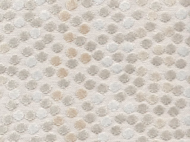 Pale cream velvet with scattered taupe, grey and blue-grey textured spots