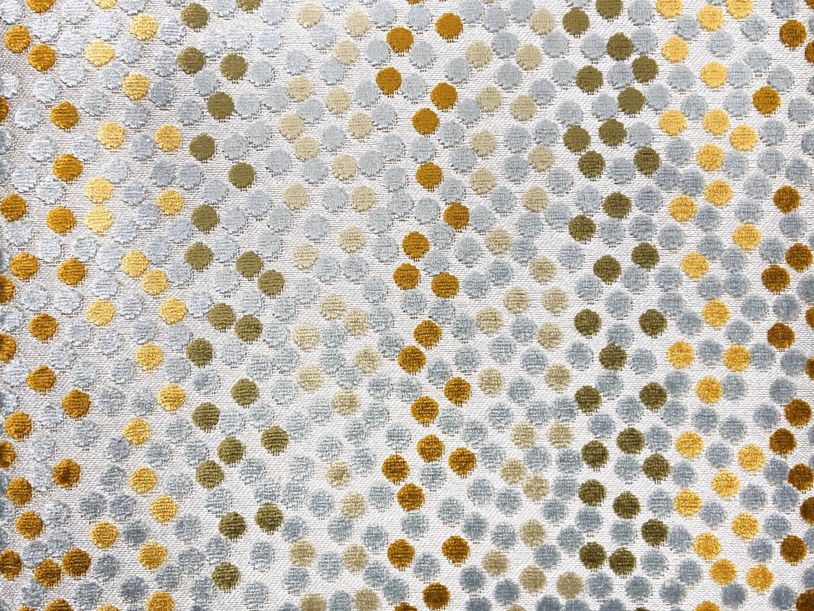 Pale grey velvet with small ochre, olive and blue-grey rounded spots